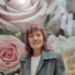 Woman on a flowers photo wallpaper background