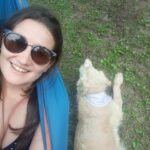 Happy customer with her dog in their garden