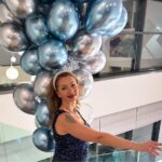 Happy customer holding baloons